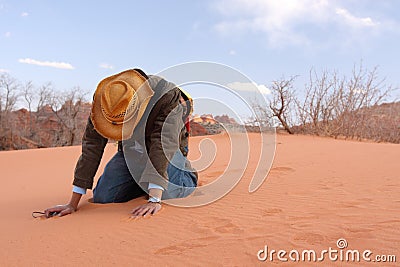 Losing faith in the desert Stock Photo