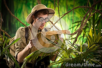 Lost explorer with old map Stock Photo