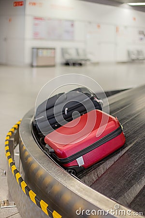 Lost luggage at the airport. Baggage sorting - Luggage on conveyor Stock Photo