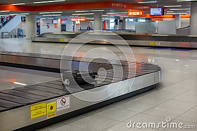 Lost luggage at the airport. Baggage sorting - Luggage on conveyor Stock Photo