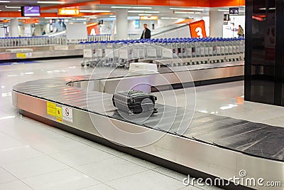 Lost luggage at the airport. Baggage sorting - Luggage on conveyor Stock Photo