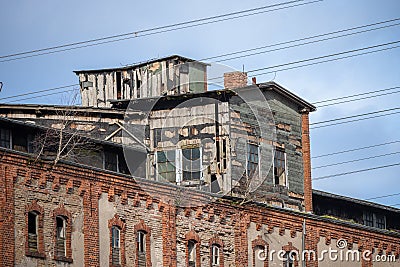 Lost place, abandoned dilapidated brick building in the old cargo port of Luebeck, Germany Stock Photo