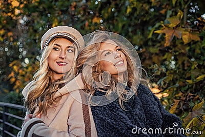 Lost in thoughts. autumn fashion and beauty. pretty girls has long curly blond hair. ladies in fall clothing in autumn Stock Photo