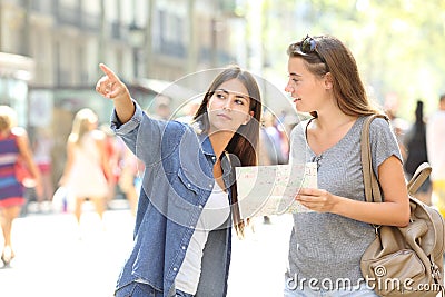 Lost tourist asking for help from a pedestrian Stock Photo