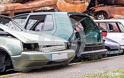 A lot of broken cars after a traffic accident in the parking lot of a service station. Sale of insurance emergency Stock Photo