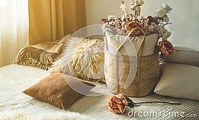 A lot of decorative cozy pillows and the inscription HOME Stock Photo