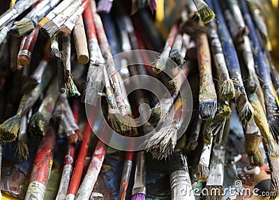A lot dirty artist paint brushes in a bucket Stock Photo