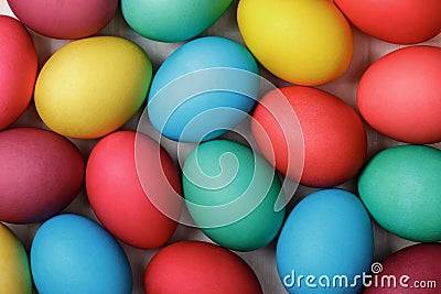 A lot of Easter multicolored eggs on a white table.Top view. Close-up Stock Photo