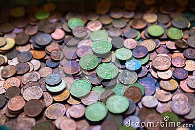 Large group of euro coins in colors in an offertory Stock Photo