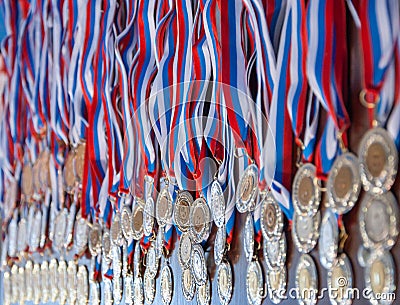 A lot of gold medals with ribbons Stock Photo