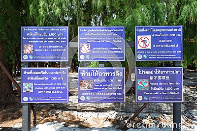 Lot of Label warning with Thai, English, China Language Editorial Stock Photo