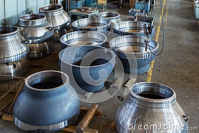 A lot of large steel pipes at a machine-building plant Stock Photo