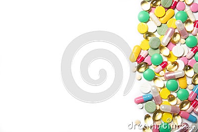 A lot of multi-colored pills on a white background. Dietary supplements. Stock Photo