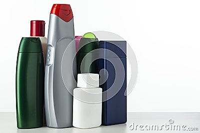 A lot of nameless plastic bottles of different colors from under a cosmetic product on a white background with place for text Stock Photo