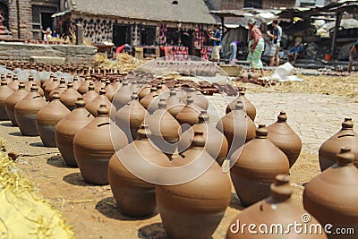 A lot of orange pots. Traditional Ceramic Pottery in Bhaktapur Town, Nepal Editorial Stock Photo