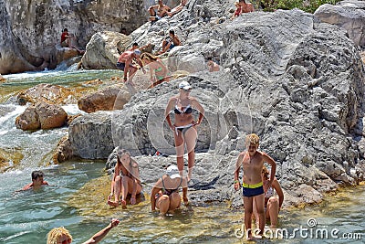 A lot of people bathing in a mountain stream canyon Kuzdere during jeep safari on the Taurus mountains. Editorial Stock Photo