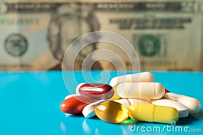 A lot of pills on the table against the dollar. Close up Stock Photo