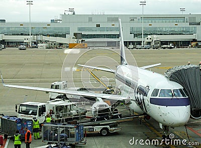 LOT Polish Airlines Embraer during turn around in Brussels airport in Belgium. Editorial Stock Photo