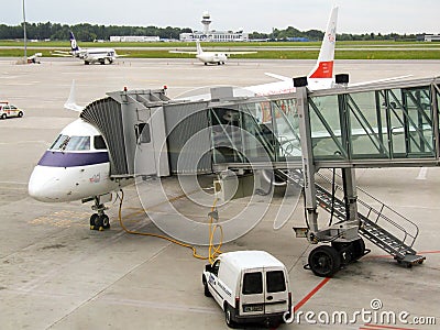 LOT Polish Airlines Embraer during turn around in Warsaw Chopin airport in Poland. Editorial Stock Photo