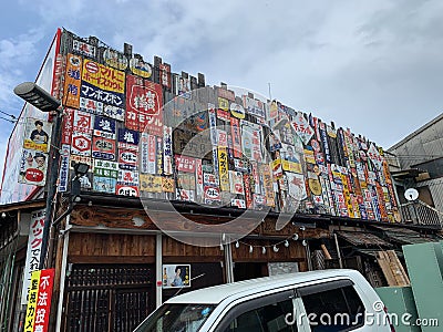 A lot of signages were beside Second-hand dealers in Japan. Editorial Stock Photo