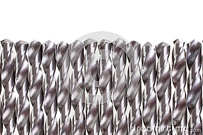 A lot of spiral drill bits isolated. Drills used in industrial repair and construction activities Stock Photo