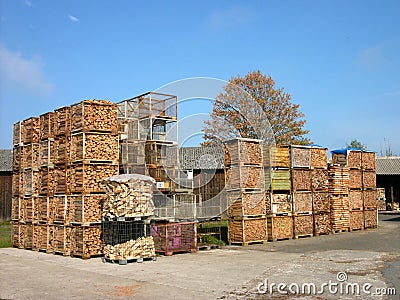 Lot of storage boxes with firewood in a factory at daytime Stock Photo