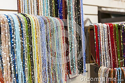 A lot of strands of beads of many colors Stock Photo