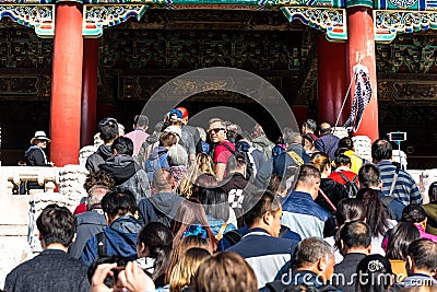 A lot of tourists entering the Taihe Palace, Hall of Supreme Harmony of the Forbidden City, the main buildings of the former royal Editorial Stock Photo