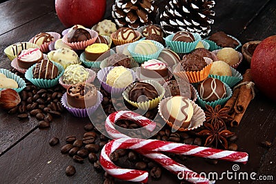 a lot of variety chocolate pralines, belgian confectionery gourmet chocolate and christmas spices with apples Stock Photo