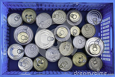 Lots of canned food in collapsible crate grocery store packing container Stock Photo