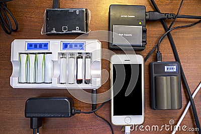 Lots of charger devices as mobile, rechargable batteries, camera Stock Photo