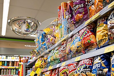 Lots of chips and crisps in a Zabka convenience store, product display, group of objects closeup, nobody, no people Editorial Stock Photo