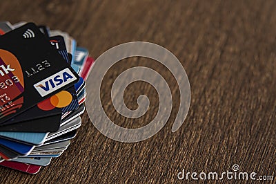 Lots of credit cards, personal debt concept. Visa and Mastercard brands Editorial Stock Photo