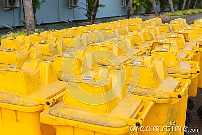 A lots of Dirty Yellow Trashcan Stock Photo
