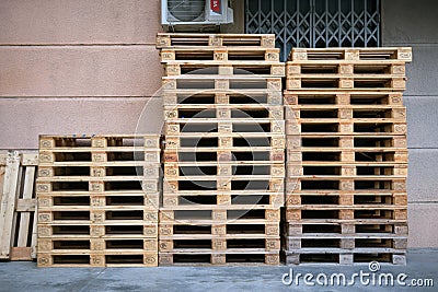 Lots of empty wooden pallets near a store or shopping center Editorial Stock Photo