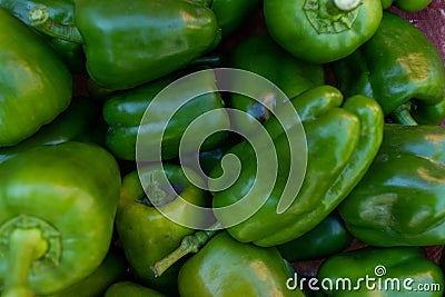Lots of fresh green sweet peppers background. View from above Stock Photo