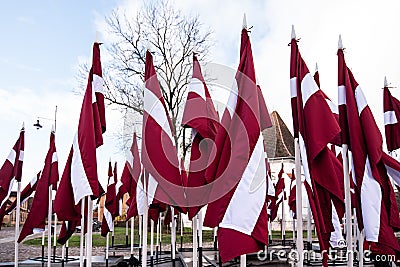 Lots of Latvian red and white flags on the day of proclamation of the Republic of Latvia Stock Photo