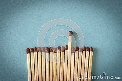 Lots of matches on a blue background. The concept of chaos and order. Selective focus Stock Photo