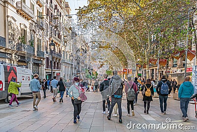 Lots of people walking along Portal de l`Angel street in Barcelona Editorial Stock Photo
