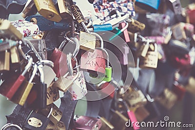 Lots of romantic wedding locks on a bridge in Prague. Toned Editorial Stock Photo