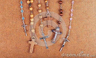 Lots of simple Christian rosaries, multiple crosses, many catholic symbols, objects group. Christianity symbolic, catholicism Stock Photo