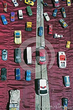 Lots of small vintage toy cars and die cast model cars in a flea market Editorial Stock Photo