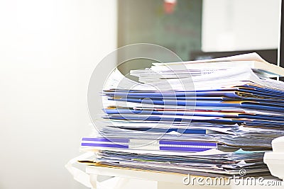 A lots of unfinished documents on office desk. Pile of documents paper. Stock Photo