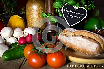 A lots of vegetables and bread on a wooden table, heart with te Stock Photo