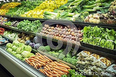 Lots of Vegetables in the Produce aisle at a Supermarket Stock Photo