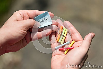 Lottery ticket in the hand, Ticket with german word Stock Photo