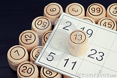 Lotto card close-up and wooden kegs Stock Photo