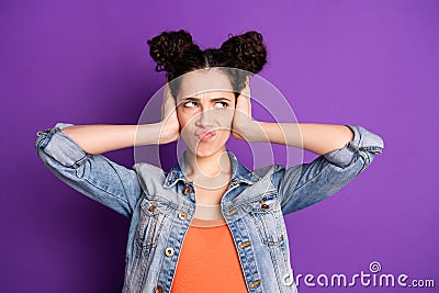 Loud music again. Close up photo of frustrated girl irritated with neighbor noise close cover ears hands look copyspace Stock Photo