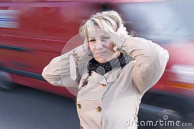 Loud traffic and woman Stock Photo