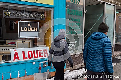 A Louer For Rent in French signs behind store windows during Covid-19 pandemic Editorial Stock Photo